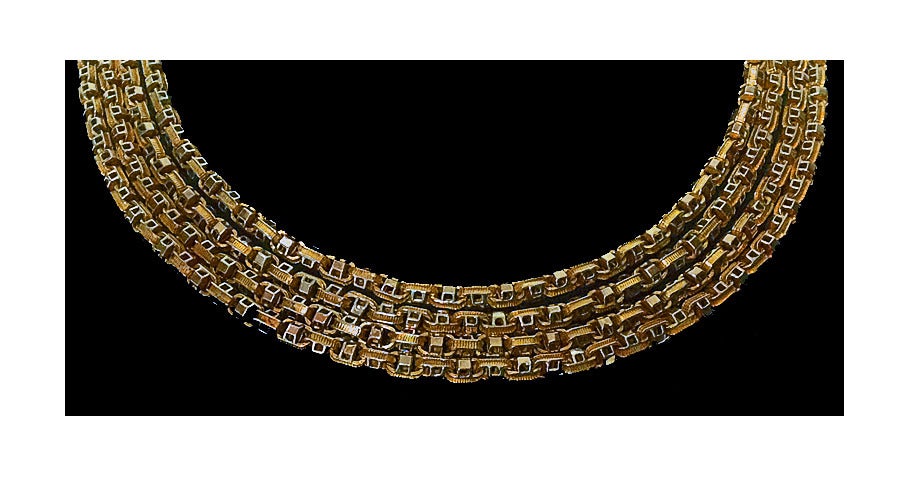 Antique 19th century Muff Chain, English C.1890. The 9ct chain with intertwining oval textured and polished open square links, suspending gold swivel. Length approximately: 61 inches. Weight: 45.6 gm.