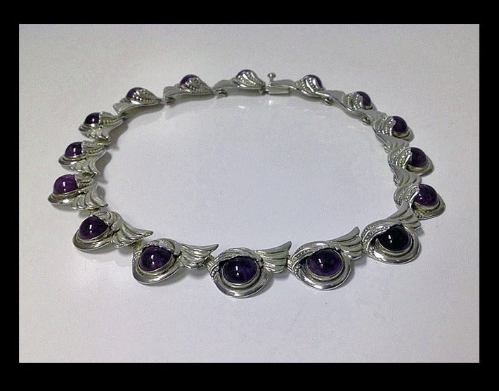 Margot De Taxco Sterling Silver Amethyst Necklace, C.1950. Stylized design, amethyst cabochon link, gauging 11 mm, stamped Sterling Made in Mexico Margot de Taxco 5240, eagle 16 mark. Length: 15 ¼