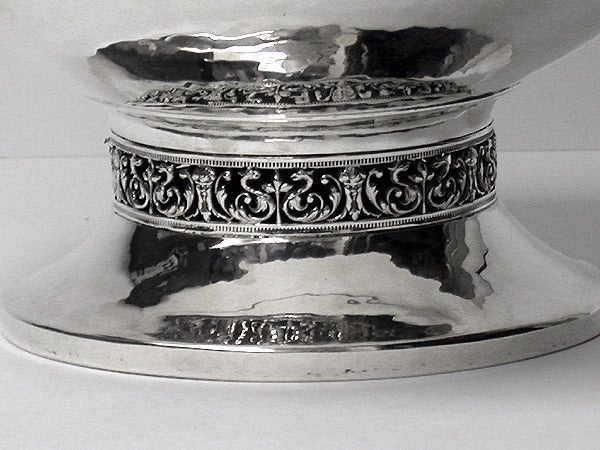 A.E.Jones Arts and Crafts Silver hammered design large Bowl, Birmingham 1920 by A.E.Jones. The Bowl on circular plain hammered base with arabesque eastern surround frieze, plain ovoid hammered body and upper frieze surround conforming. Stamped on