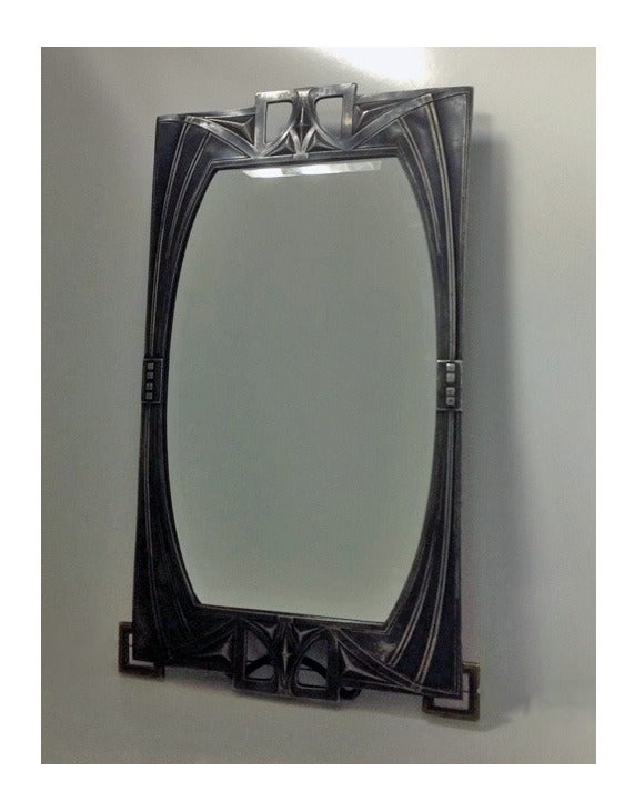 Rare WMF Art Nouveau Jugendstil Secessionist pewter Mirror, Germany C.1905. All original bevelled glass, back and easel, bracket cornice supports, stylised border with open arts and crafts surmounts. WMF marks and model No 84/38. Measures:
