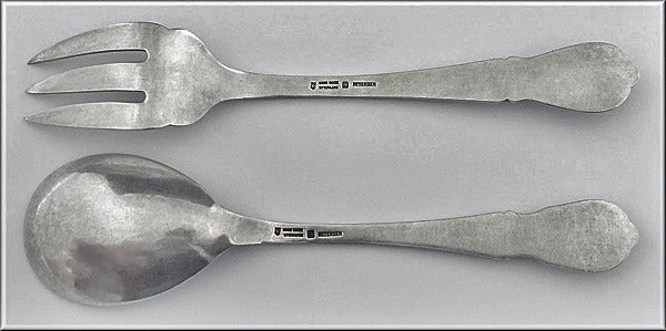 Pair of Carl Poul Petersen hammered Silver Salad Servers, Montreal. C.1930. The Servers, wild berries pattern. Stamped hand made Petersen Sterling marks on reverse. Length: 8.75 inches. Weight: 5.35 oz