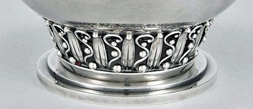 Evald Nielsen Sterling Silver Bowl, Denmark C.1930. The circular bowl in Jensen style on stepped circular foot, on an openwork band of upright stylized leaves, scrolling stems and berries, plain body, with a flared rim, Height: approximately 4 ¾
