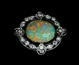Edwardian Platinum 18K Opal Diamond Brooch, signed MB Co, attributed to Murrle Bennett Co, English C.1910. The Brooch gold bezel set with a white crystal opal, gauging approx 13.0 x 15.25 x 3.8 mm, approx 4.25 ct, calculated by formula, good play of