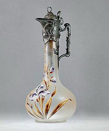 Art Nouveau WMF Mont Joye Legras & Cie Claret Jug, C.1900. The silver plate mount Claret Jug with acid glass, hand painted enamel floral design in organic Art Nouveau style depicting irises in mauve and brown tones. The Claret Jug of bulbous form