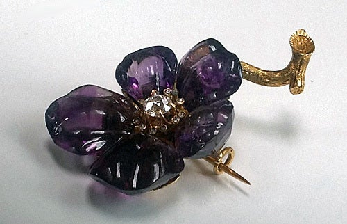 Antique 19th century Amethyst and Diamond large flower Brooch, C.1880. The brooch with five graduated size carved amethyst petals, the centre stamen set with an old cut diamond, approximately 0.70 ct, with a surround of 12 small rose cut diamonds;