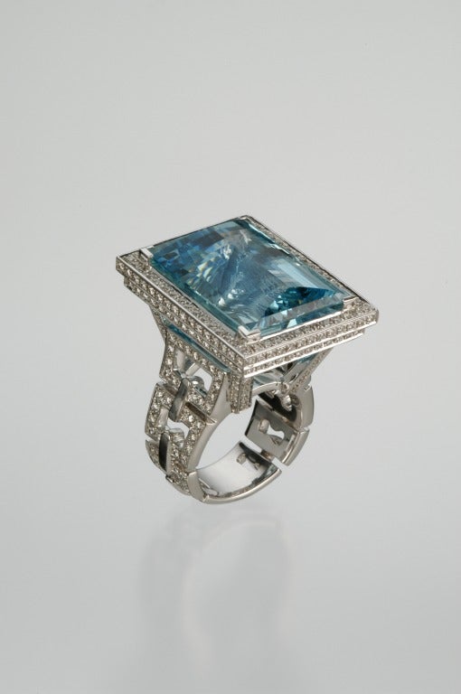A 42.08ct conversational Aquamarine set in an important 2.44ct total diamond ring.

Signed with Tamir's registered trademark.