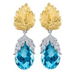 Boucles d'oreilles traditionnelles en topaze bleue de style « florentine ».