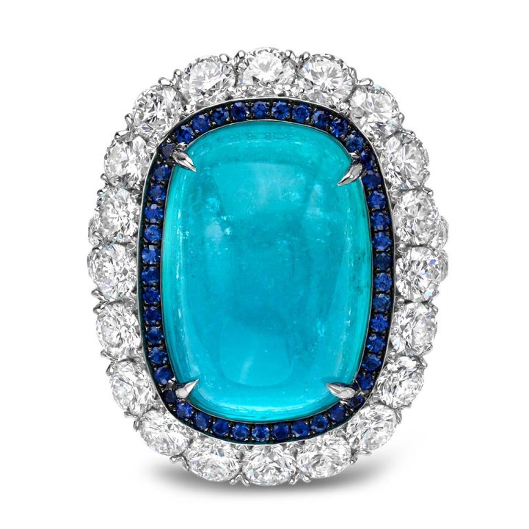 A rare and ultra exclusive 12.34ct Brazilian Paraiba Tourmaline, cushion cabochon, showcased in a 2.77ct diamond ring and framed by 0.24ct 