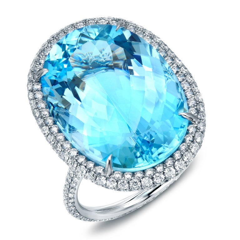 A glorious 22.20ct oval Aquamarine showcased in a completely micro-set 2.96ct, G color and VS clarity, diamond ring. Master-crafted in platinum in the USA.
Finger size 6. Can be sized to fit.
Signed Tamir.