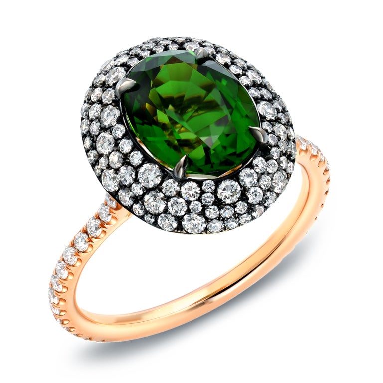 A rare and vivid green 2.62ct oval Chrome Tourmaline and 0.93ct scintillating diamonds, showcased in a master-crafted French rose gold ring topped with black-finished silver.
Finger size 6. Can be sized to fit.
Signed Tamir.
Made in the USA.