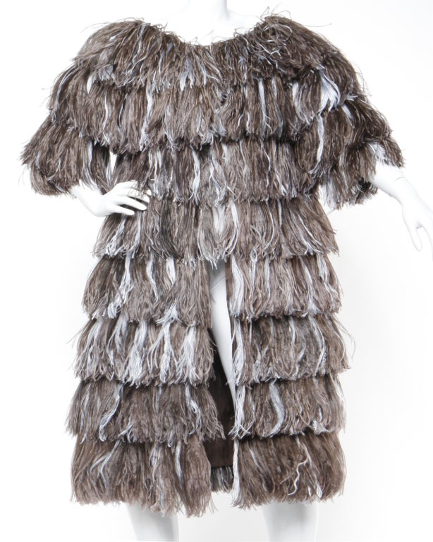 What a statement piece! A multicolored ostrich feather coat by Bill Blass that looks like it walked straight off the runway.

Bill Blass successfully did two collections featuring this feather treatment. One in the mid-1960s and again in the