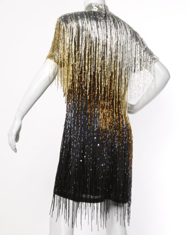 Stunning (and heavy!) metallic ombré fringe dress by Naeem Khan for Neiman Marcus. Silver, gold, copper, and iridescent midnight blue hand sequin and beaded fringe. High collar with every single bead in tact. This dress is truly a work of