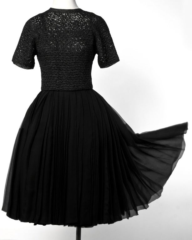 This dress has the longest sweep we may have ever seen on a dress! There is so much silk fabric on this Bud Kilpatrick for Neiman Marcus ribbon knit cocktail dress it is unbelievable in person. Lined in black silk, the dress features a metal zip and