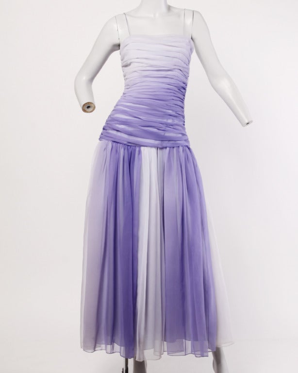 Amazing purple and white ombre maxi dress by Bill Blass! This dress features a ruched bodice, drop waistline and full skirt in washy shades of gradient purples. Spaghetti straps, fully lined with side zip closure. Bill Blass Collection III label.