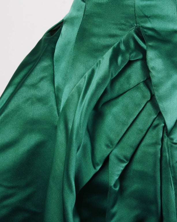 Sadly, the tags have been removed on this gorgeous dress, but the owner promises that this is a Ceil Chapman. Ceil Chapman used this same green silk satin fabric on many of her pieces and when you look at the hand sewn couture construction from the