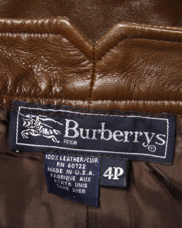 Gorgeous soft buttery leather pants by Burberrys from the 1990s. These pants feature front button and zip closure, a straight leg, and back notch at the back of the waistband. Fully lined and a marked size 4P.