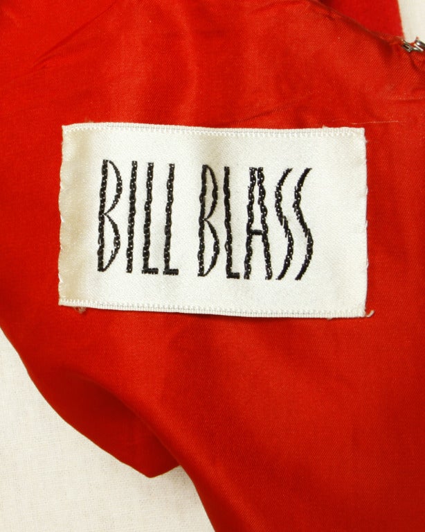 Gorgeous cherry red wool coat dress by Bill Blass. This coat features diagonal 