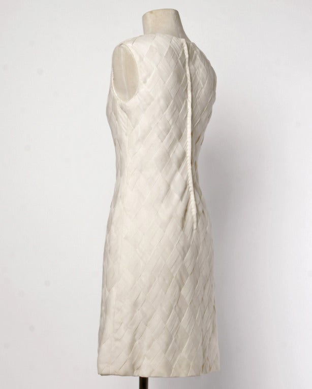 A unique and gorgeous piece! This 1960's shift dress in made up entirely of woven silk chiffon and looks unworn. The fabric weave is entirely hand done and the dreamy chiffon is incredible quality. Fully lined with a rear metal zip. So simple and