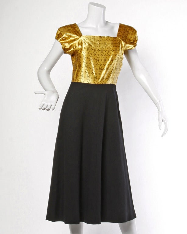 Gold and brown printed satin jacket and dress set from the 1940s. The jacket features front button closure and the dress metal zip closure. An amazing set in phenomenal condition!

DETAILS:
Dress is unlined with side zip closure
Jacket is