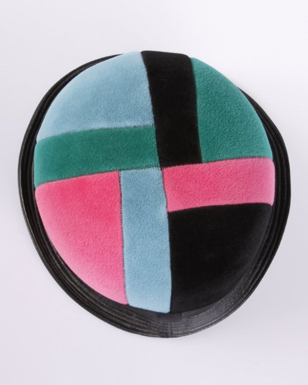 Iconic 1960s Yves Saint Laurent! This color block helmet hat is an extremely rare find in an extremely rare color combination. In soft pink, green, blue and black wool felt patchwork the hat has a very round mod shape and an irregular soft black