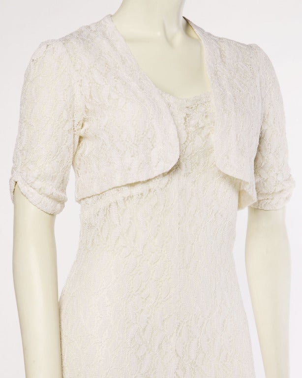 Vintage 1930's ivory lace maxi dress with a matching bolero jacket and side snap closure. A perfect vintage wedding dress!

DETAILS:

Unlined
Circa: 1930s
Estimated Size: S
Colors: Ivory 
Fabric: Lace

MEASUREMENTS:

Dress:
Bust: Up to
