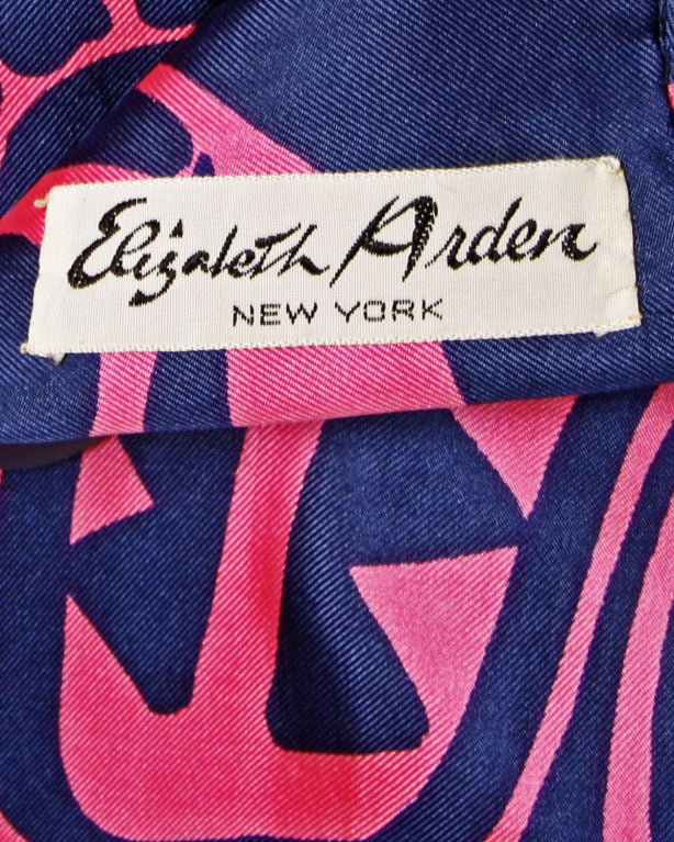 Creamy silk vintage dress in vibrant pink and navy blue by Harry Algo for Elizabeth Arden. Fantastic tribal print and plastic button detailing. Gorgeous quality fabric and construction.

DETAILS:

Fully Lined
Back Button Closure
Circa: