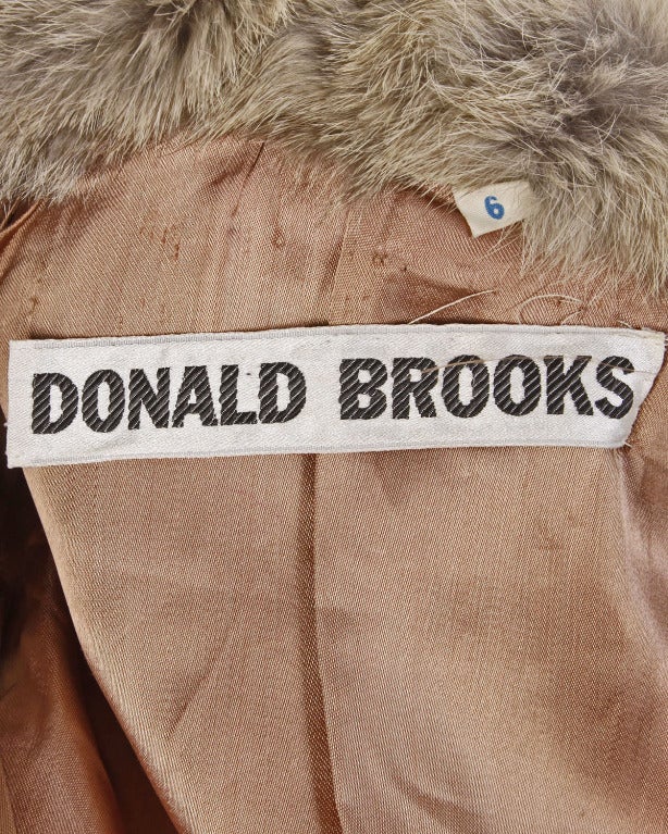 Amazing Donald Brooks patchwork rabbit fur coat with double breasted buttons and belled sleeves. Fully lined in brown silk satin. Thick soft rabbit fur in excellent condition.

DETAILS:

Fully Lined
Front Button Closure
Side Pockets
Circa: