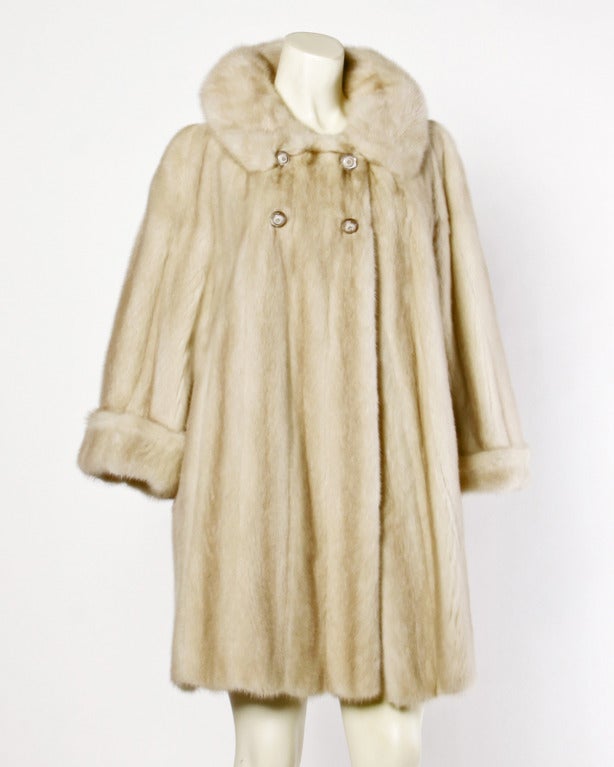 Plush blond mink fur coat and matching hat. Cuffed sleeves and pop up collar. Both pieces are fully lined.