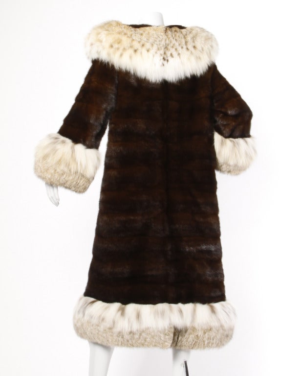 Absolutely stunning horizontal mahogany mink fur coat with luxe spotted Lynx fur trim, cuffs and pop up collar. Fur is in excellent condition. Mink is shiny and plush. Lynx is fluffy, full and soft. A gorgeous piece!

DETAILS:

Fully Lined
No