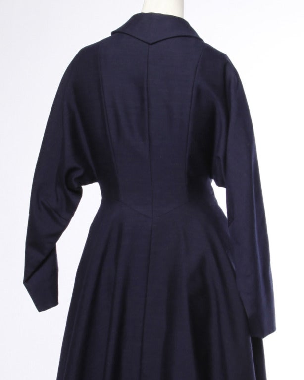 Gorgeous tailored navy blue new look coat dress with princess seams and a structured collar. Flared skirt and rhinestone buttons.

DETAILS

Front Button / Snap Closure
Fully Lined
Color: Navy Blue
Fabric: Feels like Wool
Label: Blum's San
