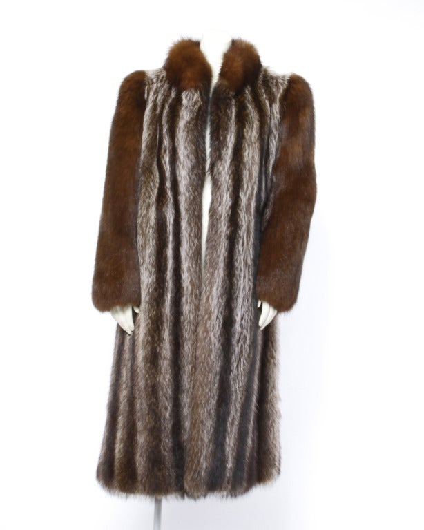 Gorgeous full length raccoon fur coat with brown fox fur sleeves and collar.

Details

Fully lined
Front hook closure
Circa: 1980s
Estimated Size: M-L
Fabric: Genuine Raccoon Fur / Genuine Fox Fur

Measurements

Bust: 42