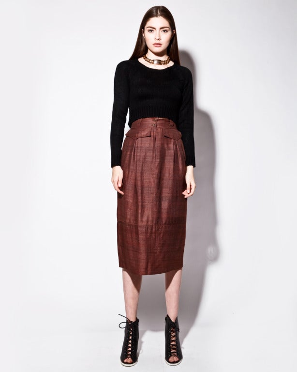 Delicate raw silk pencil skirt by Alberta Ferretti. Front flap pockets and unique rear stitching detail.

Details

Unlined
Front zip and button closure
Side pockets
Back pockets
Circa: 1990s
Label: Alberta Ferretti
Estimated Size: