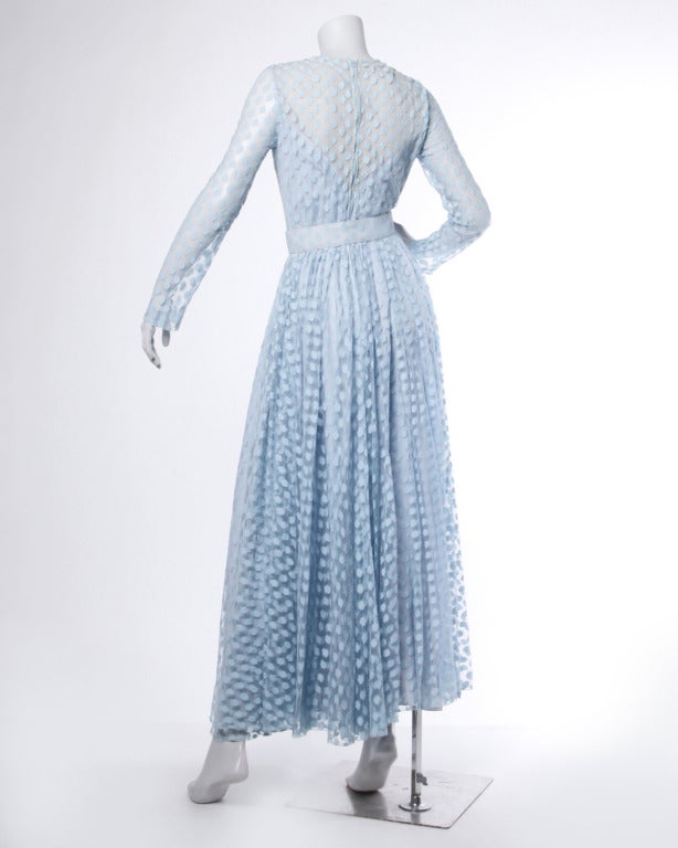 Baby blue sheer lace maxi dress by Victor Costa. This dress has long sheer sleeves and a matching belt.

Details

Partially lined
Back zip closure
Matching belt included
Circa: 1970s
Label: Romantica by Victor Costa
Estimated Size: