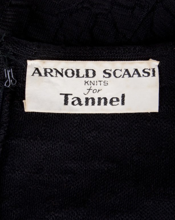 Darling little black dress by Arnold Scaasi Knits for Tannel. Empire waist, asymmetric bow embellishment, and short sleeves.

Details

Unlined
Back Metal Zip and Hook Closure
Circa: 1960s
Label: Arnold Scaasi Knits for Tannel 
Estimated