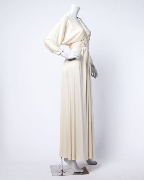 Vintage jersey knit maxi dress by Estevez! Plunging neckline with draping and batwing sleeves.

Details

Unlined
Back Zip and Hook Closure
Circa: 1970s
Label: Estevez
Marked Size: 8
Estimated Size: S
Color: Cream

Measurements

Bust: