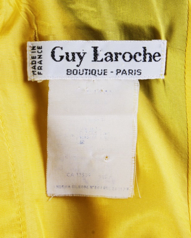 Yellow and black sheath dress with an open criss cross back by Guy Laroche.

Details

Fully Lined
Back Zip Closure
Circa: 1980s
Label: Guy Laroche 
Estimated Size: M
Colors: Black / Yellow

Measurements

Bust: 34