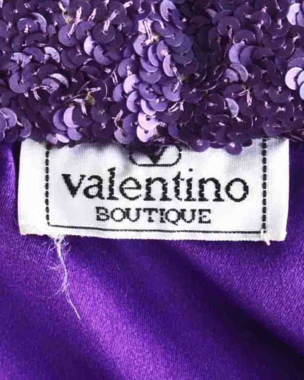Rare late-1960s color block sequin sheath dress by Valentino Boutique. Purple silk satin lining and allover sparkle.

Details

Fully lined
Back zip and hook closure
Circa: 1960s
Label: Valentino
Marked Size: 6
Estimated Size: S-M
Colors: