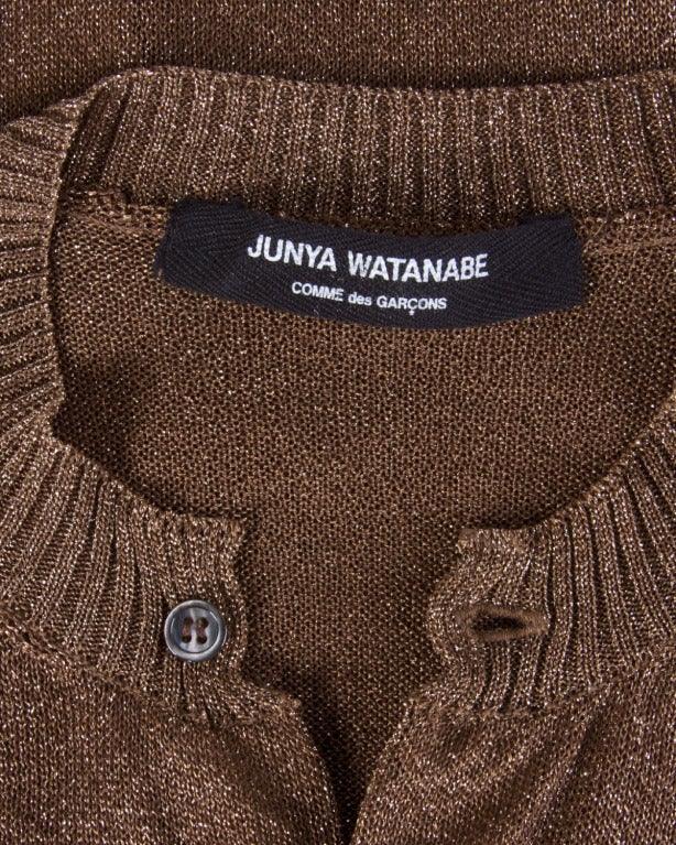 Vintage metallic bronze cardigan sweater by Junya Watanabe for Comme des Garcons. Sheer and chic. 

Details

Unlined
Front Button Closure
Circa: 1990s
Label: Junya Watanabe
Estimated Size: S
Color: Metallic Bronze

Measurements

Bust: