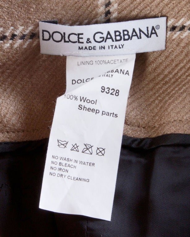 Gorgeous plaid wool culottes with black buttery leather backs. From the front these shorts look like a skirt!

Details

Partially lined
Front zip and button closure
Side pockets
Circa: 1990s
Label: Dolce & Gabbana
Estimated Size: