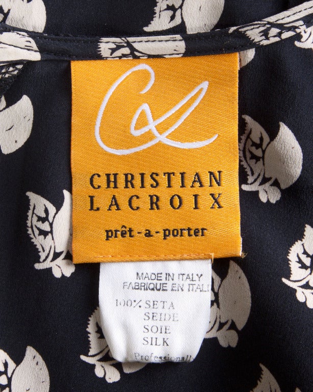 Christian Lacroix black and tan floral print silk top.

Details

Unlined
Back zip closure
Circa: 1990s
Label: Christian Lacroix
Marked Size: 4
Estimated Size: S-M
Colors: Taupe / Black
Fabric: 100% Silk

Measurements

Bust: