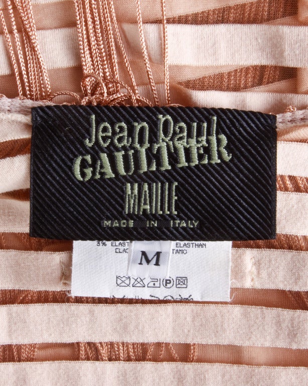 Jean Paul Gaultier burn out striped body con dress with long swinging fringe and a deep-V plunging neckline.

Details

Unlined
Label: Jean Paul Gaultier
Marked Size: M
Estimated Size: M
Colors: Peach
Fabric: 100%