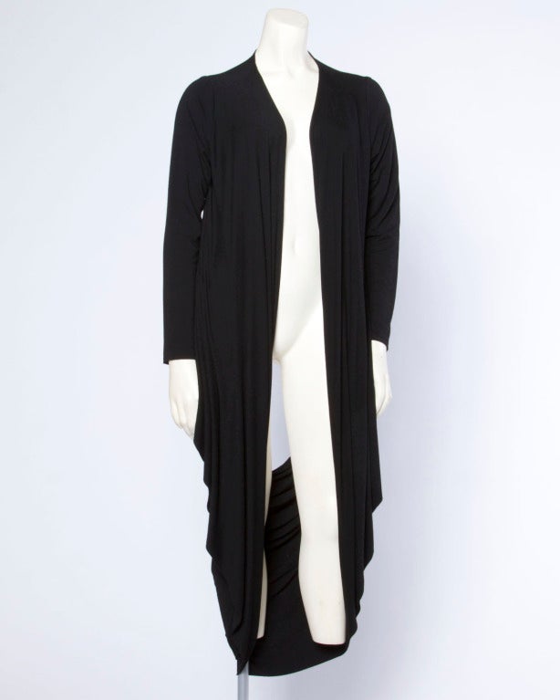 Black draped cardigan by Norma Kamali Omo. Unique cut can be worn many different ways!

Details

Unlined
Label: Norma Kamali 
Marked Size: XS/S
Estimated Size: XS-M
Color: Black
Fabric: 95% Rayon 5% Spandex

Measurements

Bust: Up to