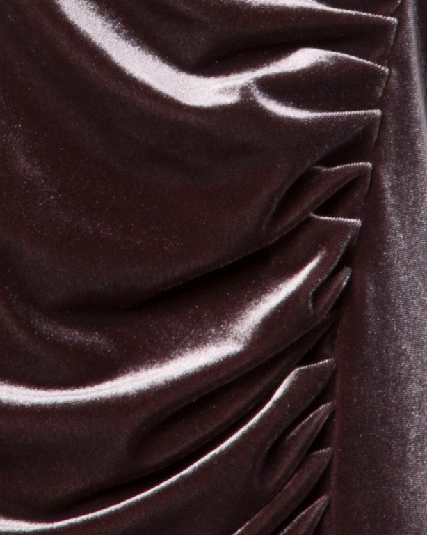 Brown-mauve soft silk velvet dress with asymmetric ruching by Armani Collezioni. Unlined with slight stretch to the fabric. Rear zip closure.

Bust: 36-40