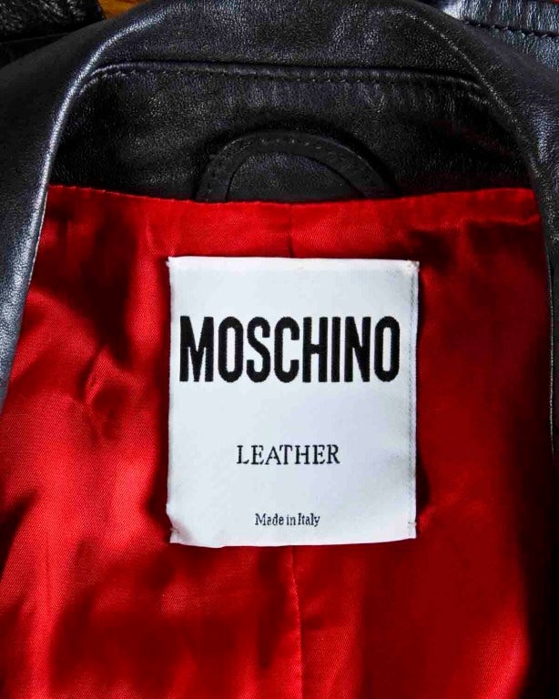Soft and thick buttery leather vest by Moschino Leather. Heavy duty brass tone hardware and contrasting red lining.

Details:

Fully lined in red fabric
Front zip and toggle closure
Front pockets
Circa: 1990s
Label: Moschino
Estimated Size: