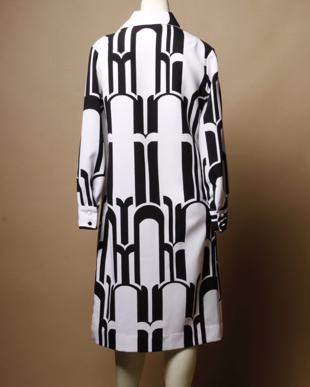 Vintage black and white Lanvin logo print dress. Unlined. Front button closure. Matching waist sash included.

DETAILS:

Circa: 1970s
Label: Lanvin
Marked Size: 8
Estimated Size: M
Color: White / Black
Fabric: