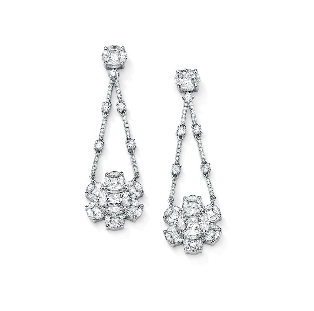 These handmade 18kt White Gold Diamond Chandelier Earrings feature 6.51ct tw multi shape Diamonds in a fabulous flirty floral design.

Secure post backings make these earrings very comfortable to wear.

David Rosenberg is President of the