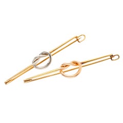 CARTIER NEW YORK- A Pair of Retro Tri Gold Brooches