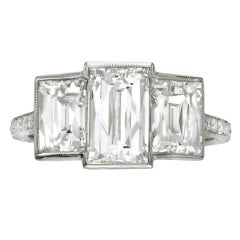 A Tycoon cut diamond three stone ring