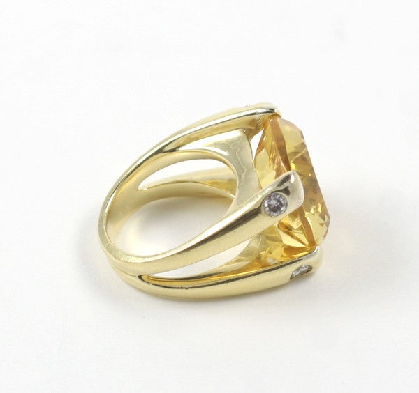18kt Yellow Gold split shank dome ring with center Cushion Cut Citrine (approximately 25cts) and four diamonds(approximately 0.40cts). 

Made to Order

This ring can be made with any color combination that you like.

Please contact us with any