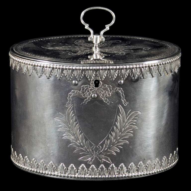 A good Georgian tea caddy of oval form the engraved lid surmounted by a loop handle. The body decorated with bead and leaf chased border and leaf and ribbon engraving around the vacant cartouche. 

Signed/Inscribed/Dated: Sheffield 1775 by Richard